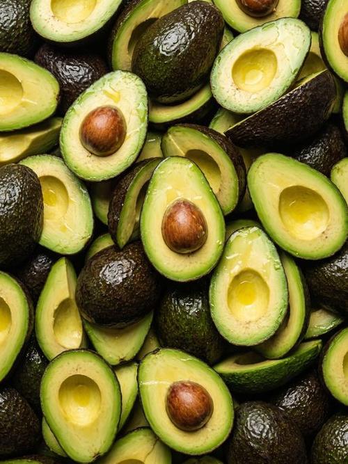 Halved fresh avocados